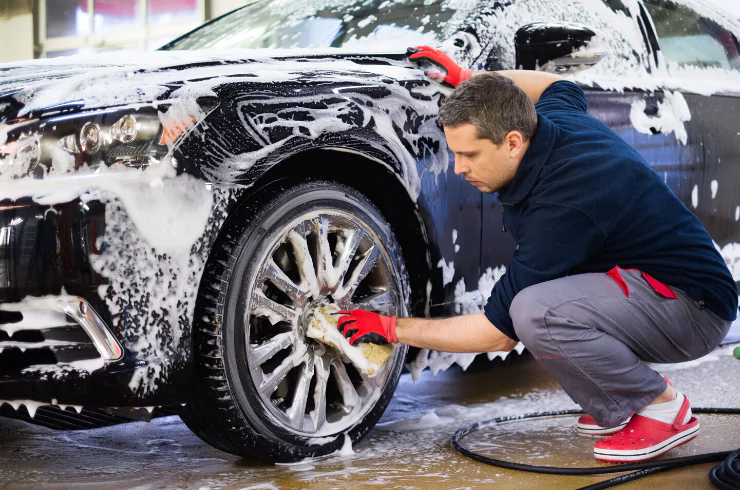 image of car washed by man